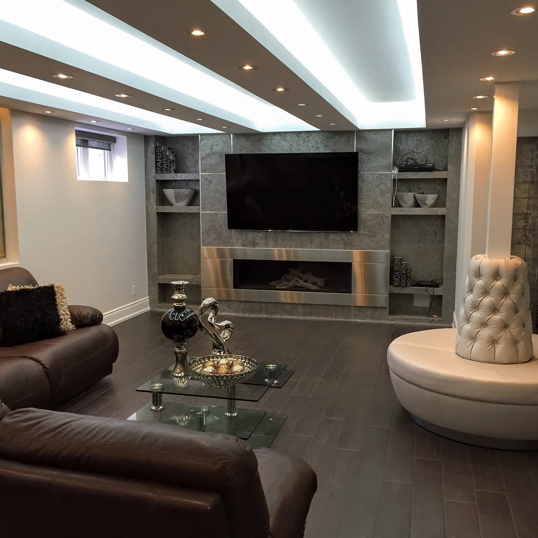 Finished basement lounge with cove lighting — Reno-eX basement renovation