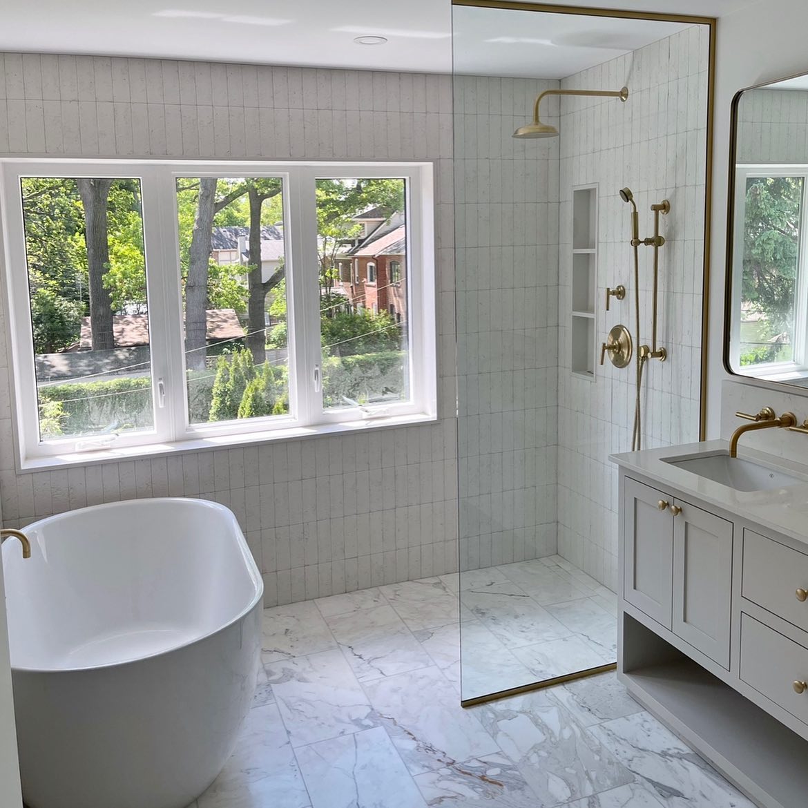 Walk-in shower with brass trim — new ensuite built from a spare bedroom, High Park, Toronto