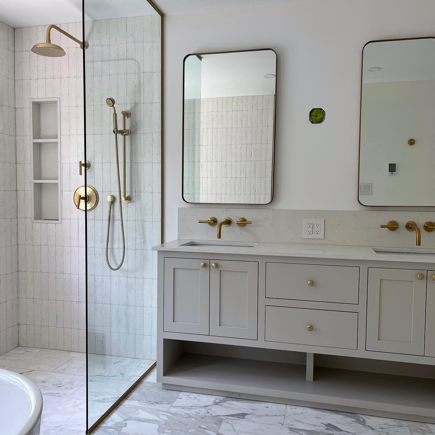 Bright ensuite with freestanding tub and brass fixtures — Reno-eX bathroom renovation, High Park, Toronto