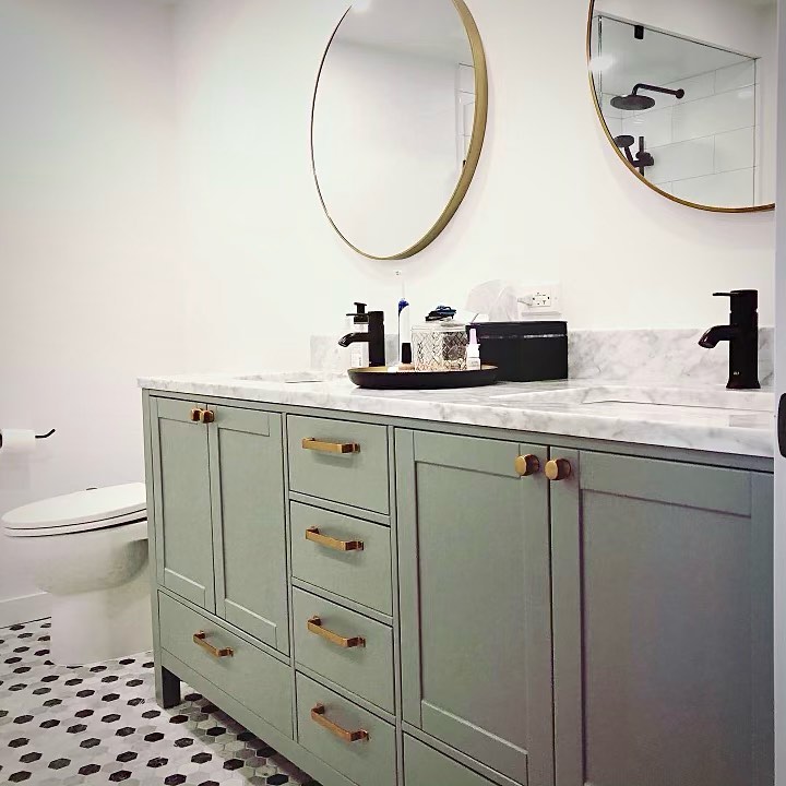 Sage-green vanity with brass hardware — Reno-eX bathroom renovation