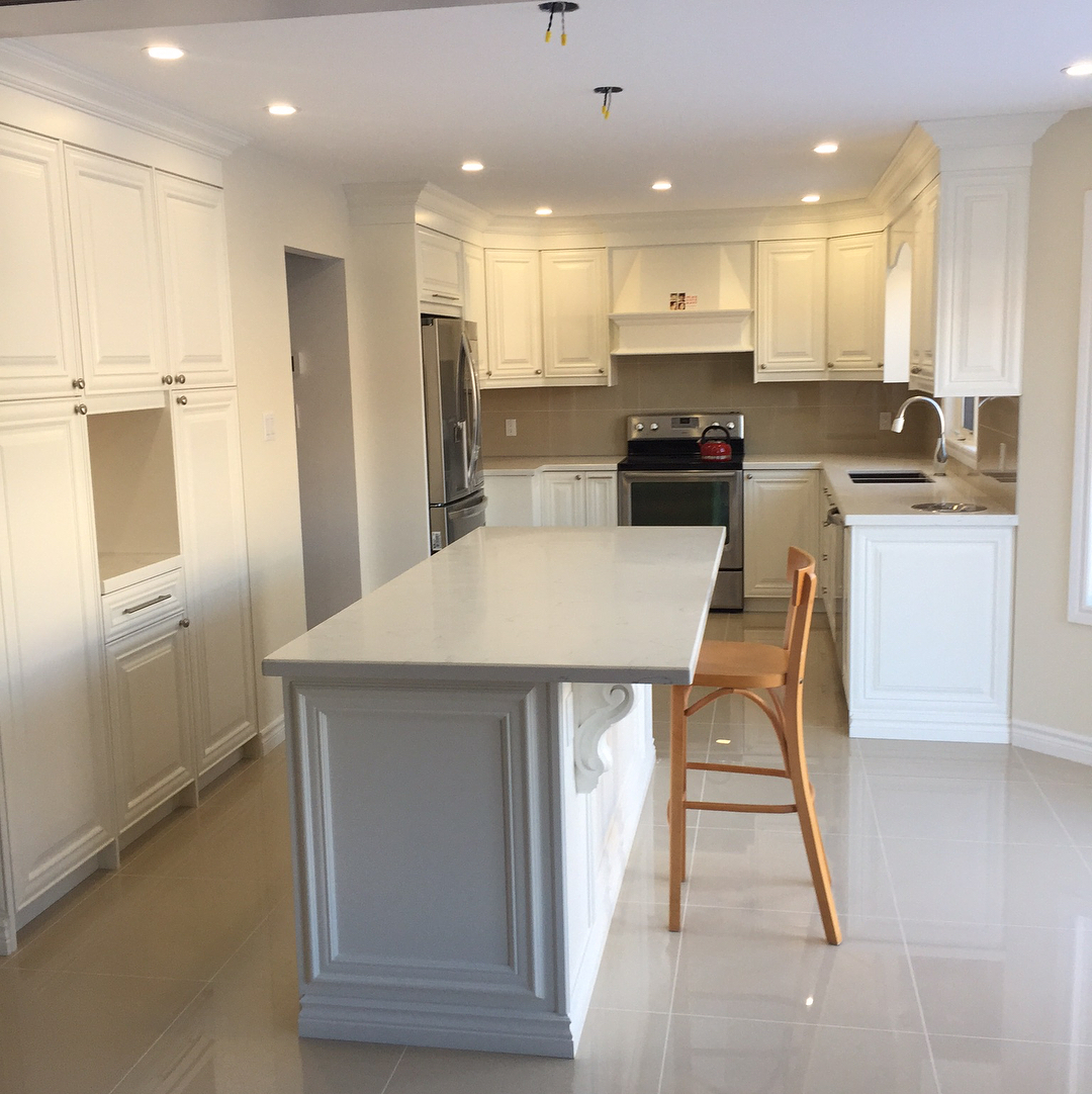 Custom white kitchen with quartz island — Reno-eX kitchen renovation